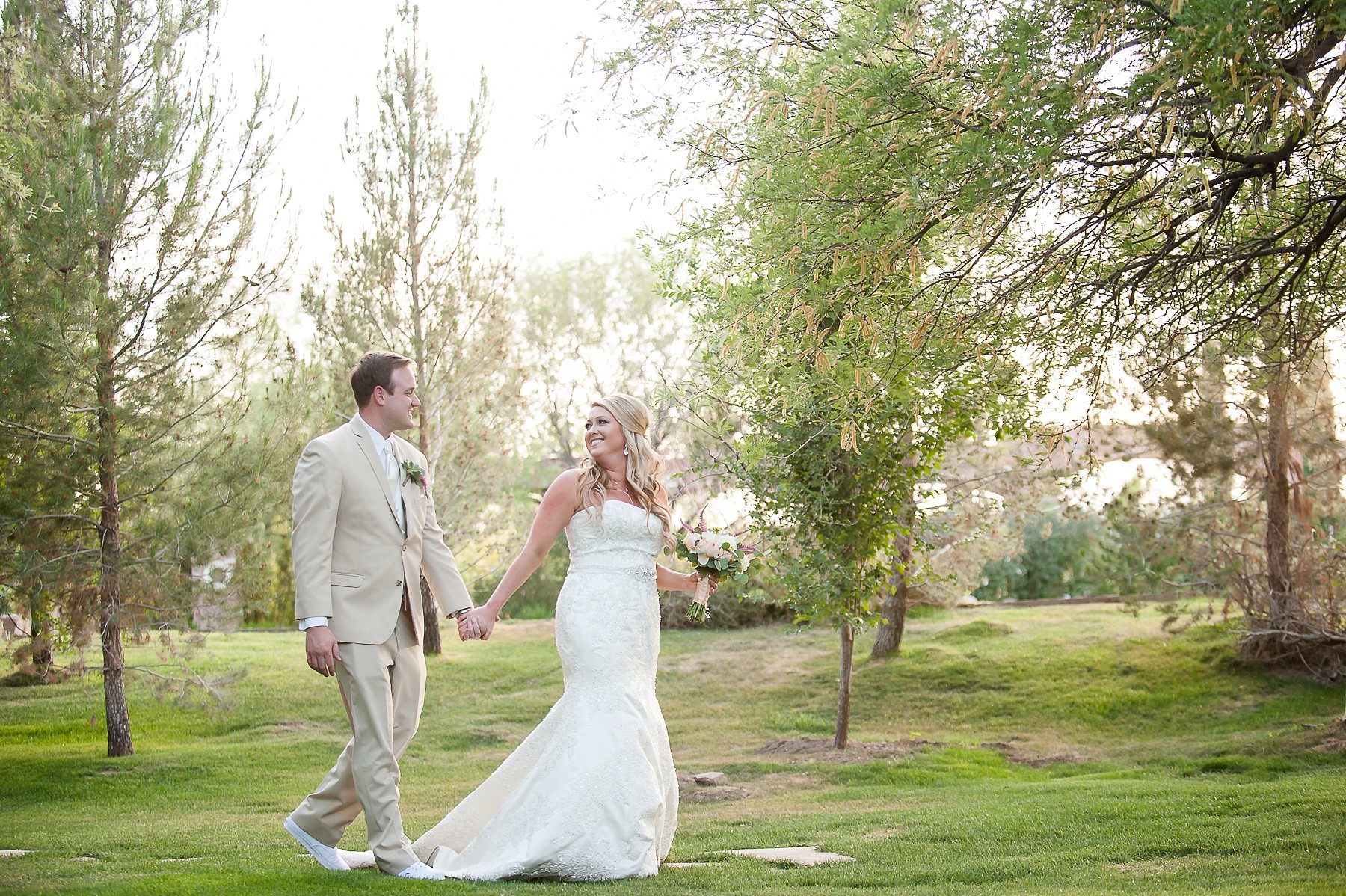 Windmill Winery Wedding Groom Bride Walking Smiling Greenery Phoenix Arizona Photo