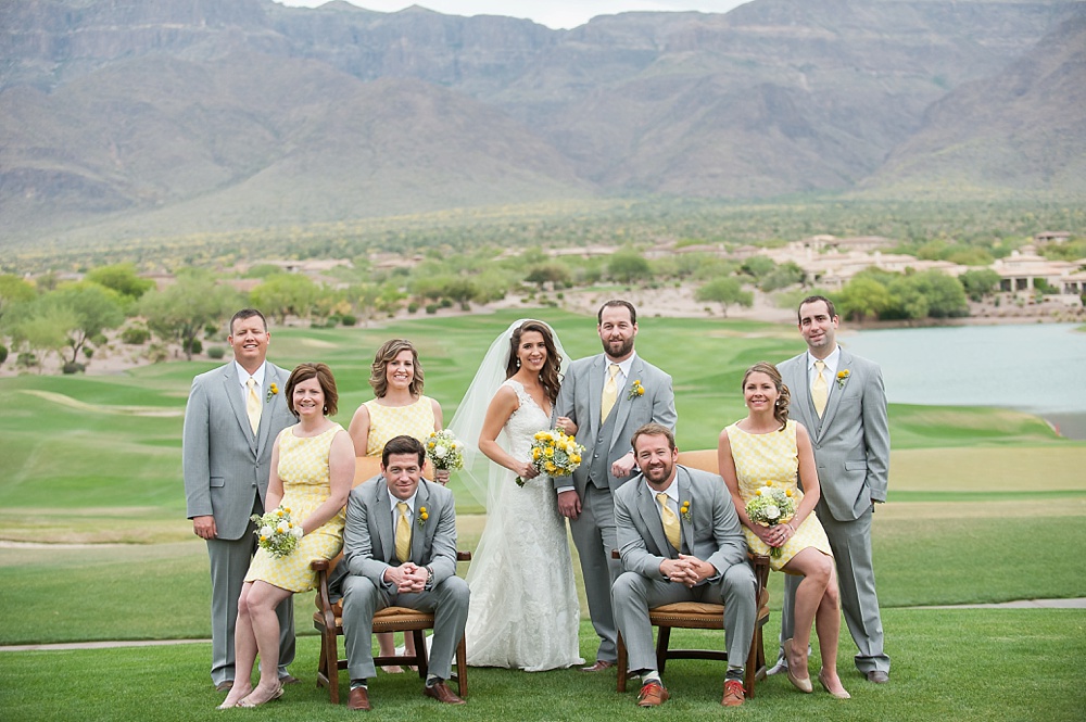 Superstition Mountain Wedding Bride Groom Embracing Smiling Bridal Party Sitting Gold Canyon AZ Photographer