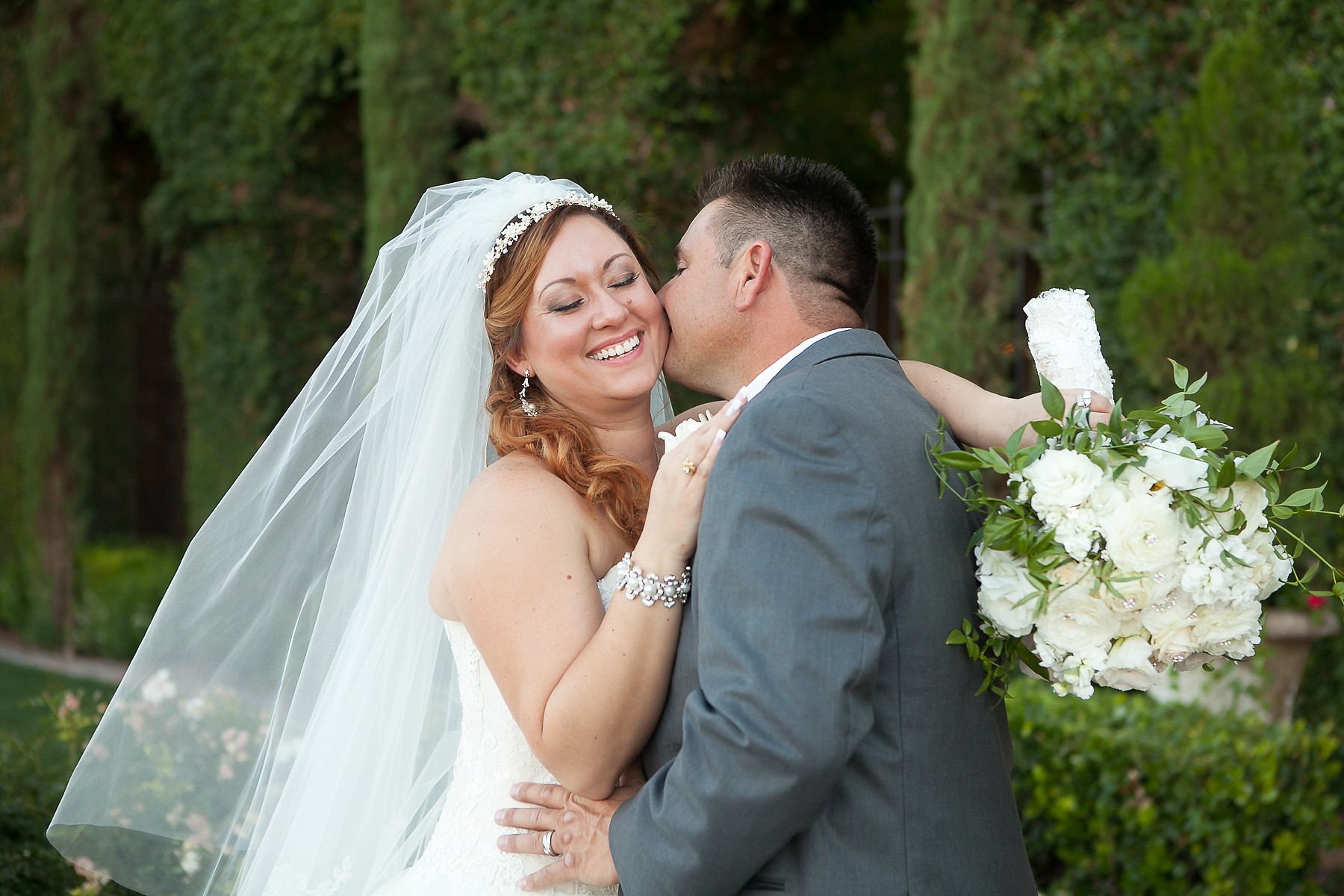 Villa Siena Wedding Bride Groom Embracing Smiling Kissing Dress Bouquet Gilbert Arizona Photos
