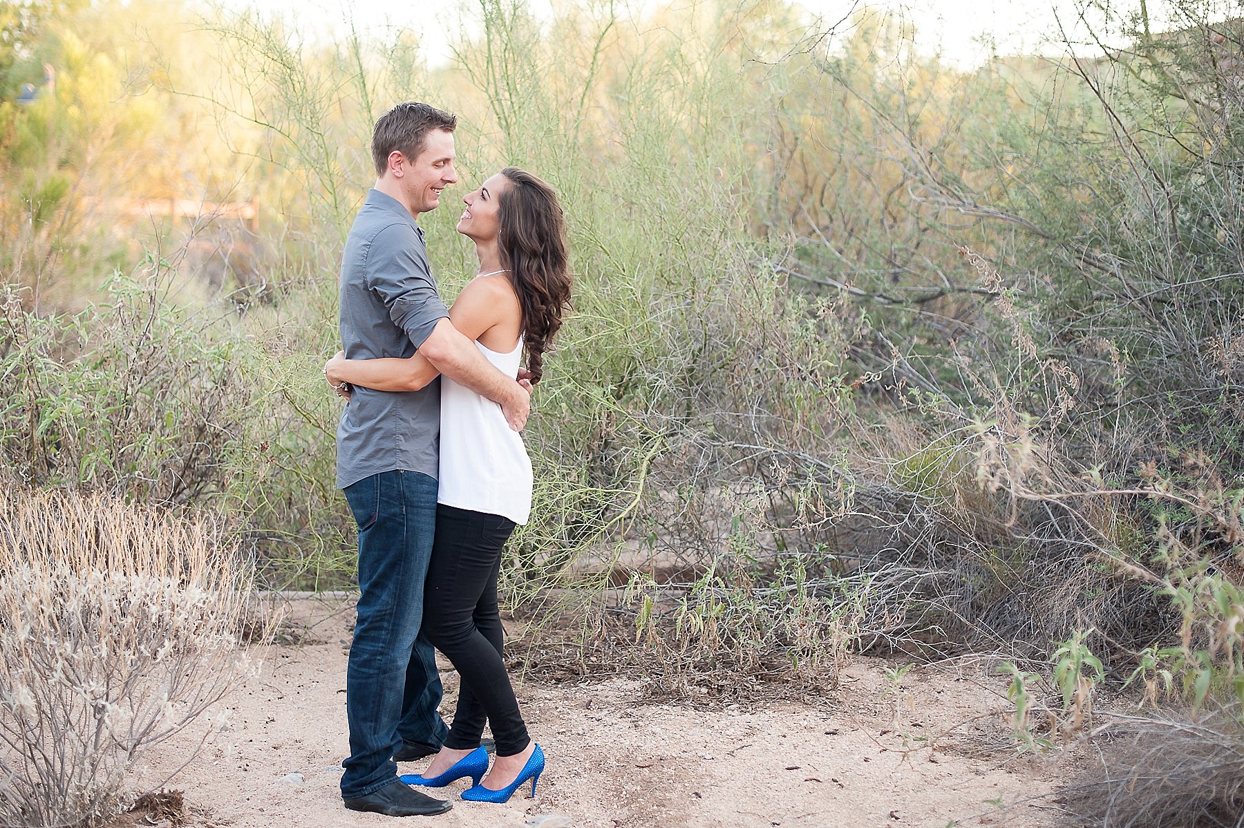 Scottsdale Engagement Couple Embracing Desert Blue Shoes Gilbert Arizona Photo