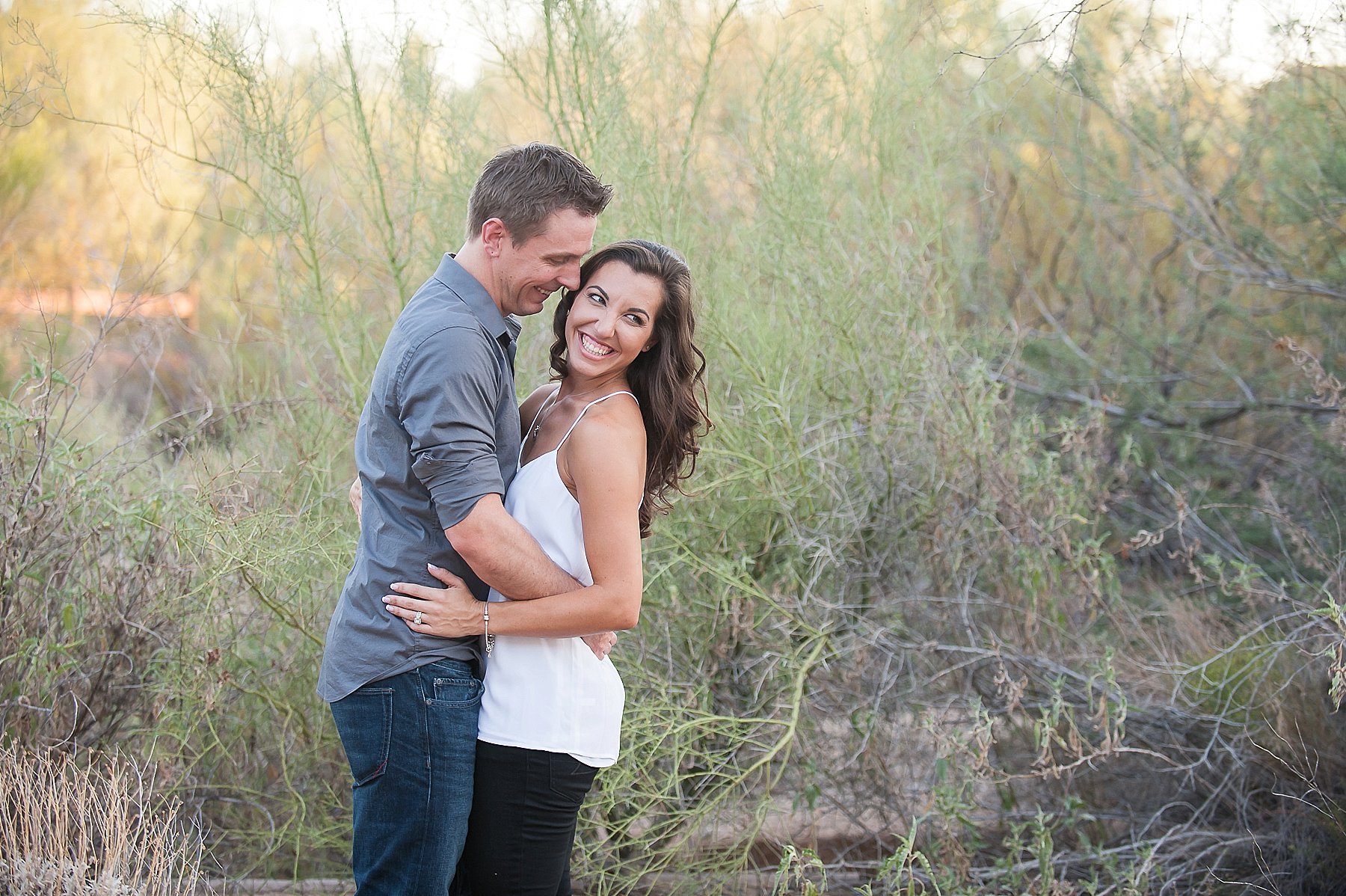 Scottsdale Engagement Couple Smiling Embracing Desert Gilbert Arizona Photo