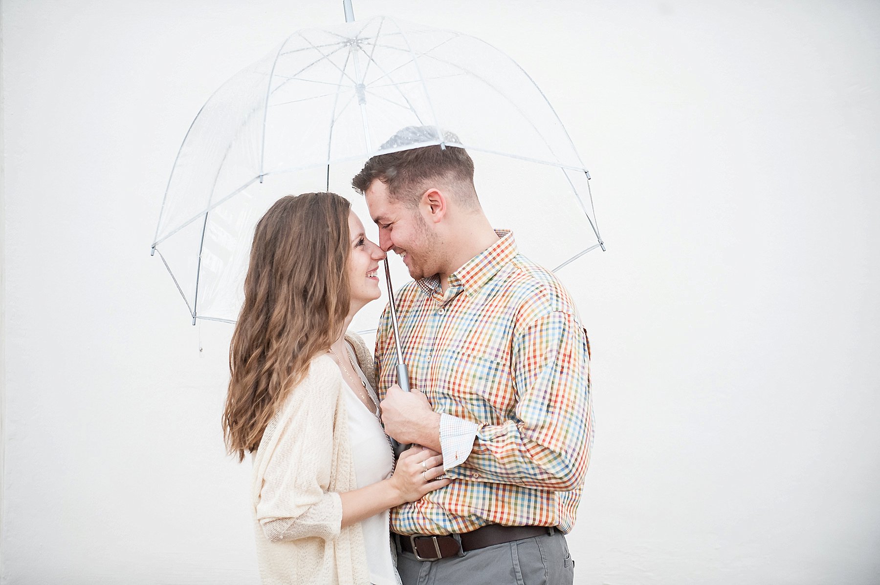 Scottsdale Engagement Couple Smiling Umbrella Raining Arizona Photo