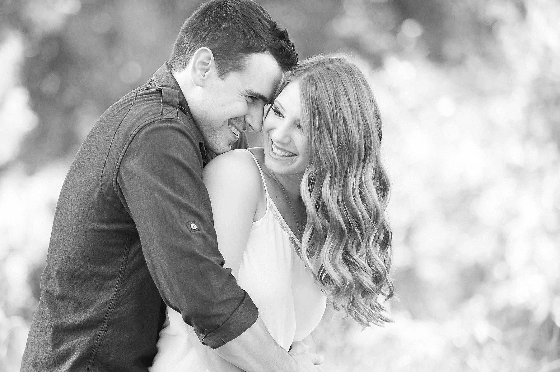 Red Rock Engagement Couple Embracing Laughing Black and White Sedona Arizona Photo
