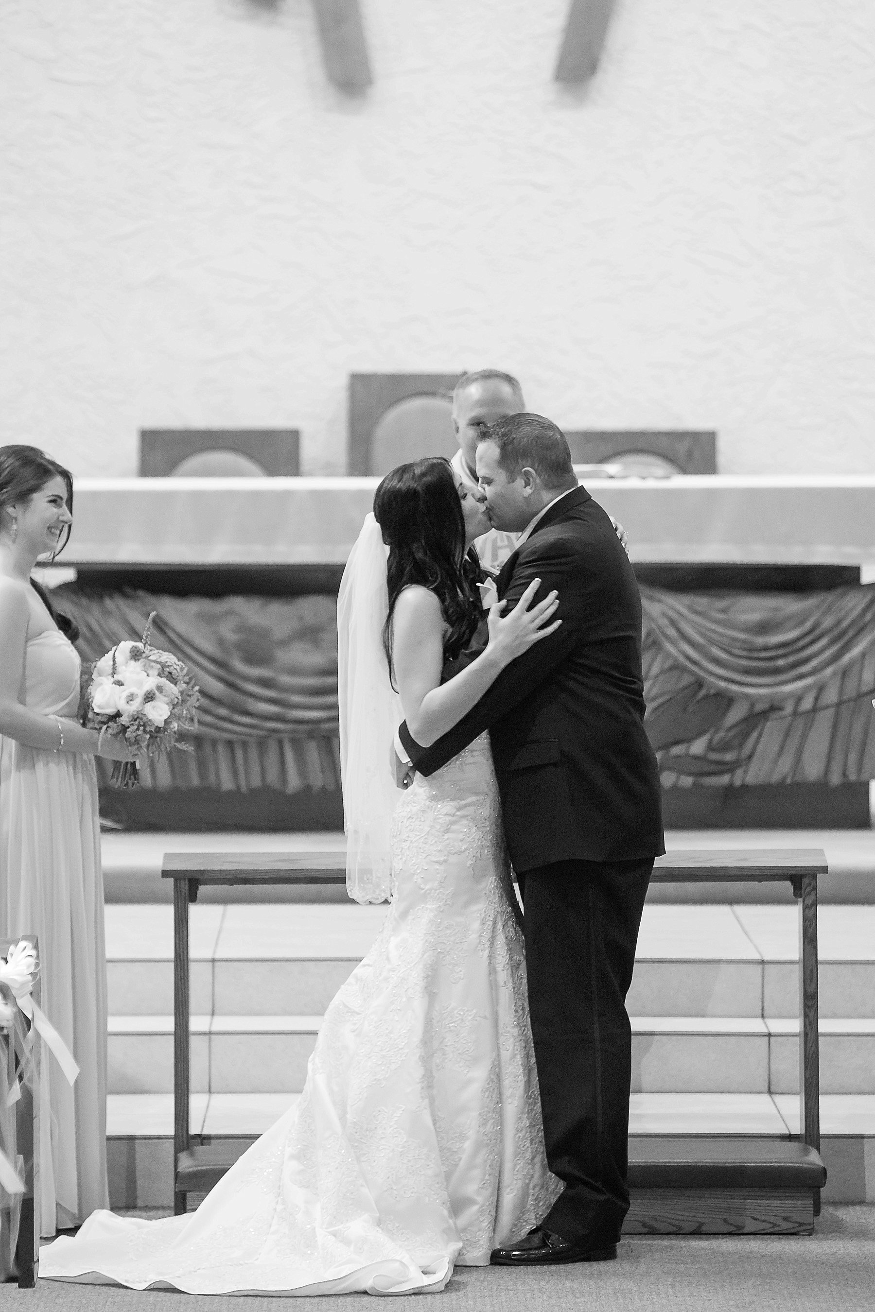 Our Lady Perpetual Help Scottsdale Wedding Ceremony Bride Groom Kiss Arizona Photo
