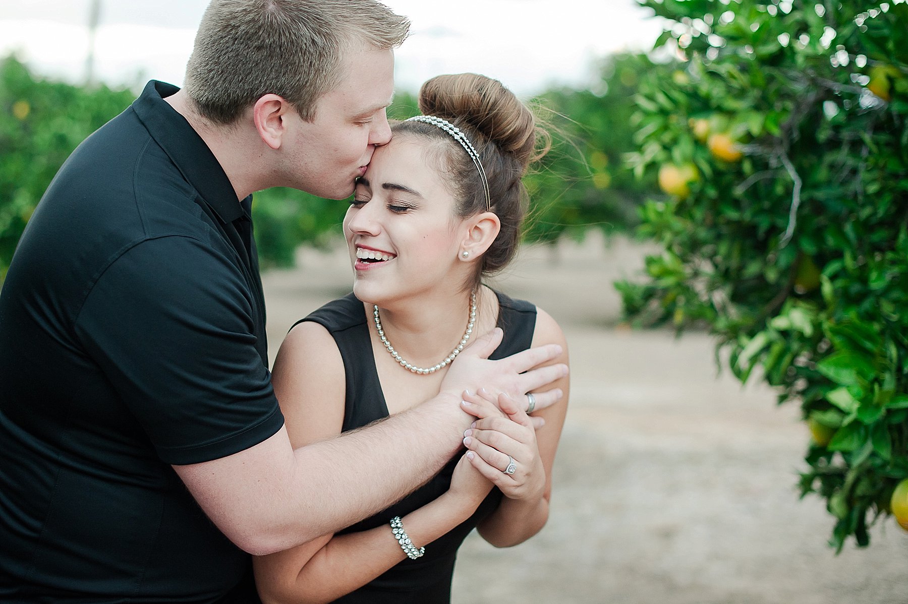 Seville Engagement Couple Laughing in Citrus Field Gilbert Arizona Photo
