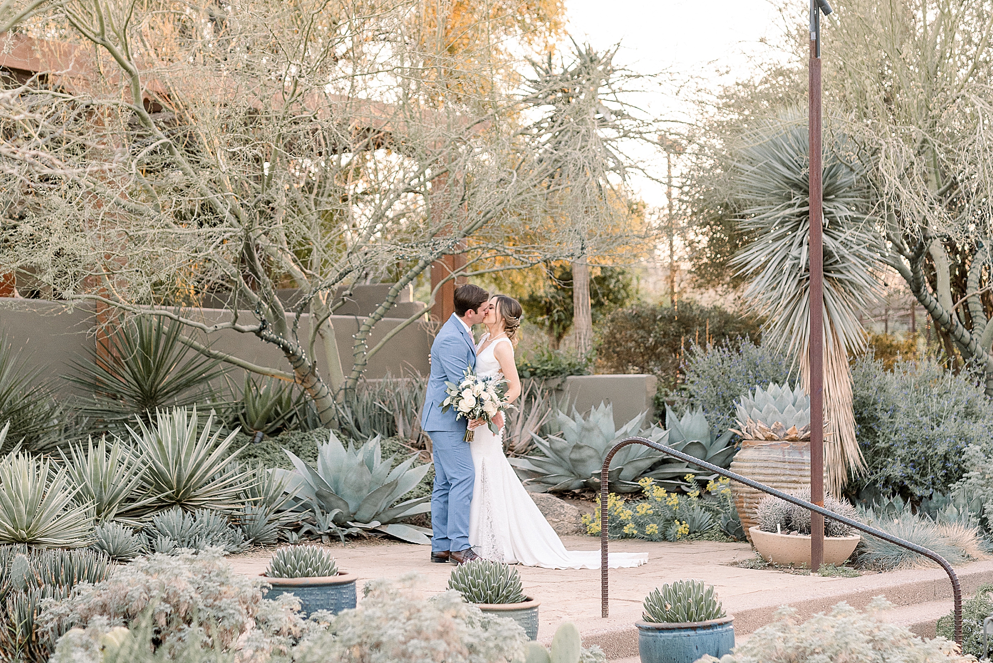 Bride and Groom Kissing at the Desert Botanical Gardens in Phoenix on Wedding Day