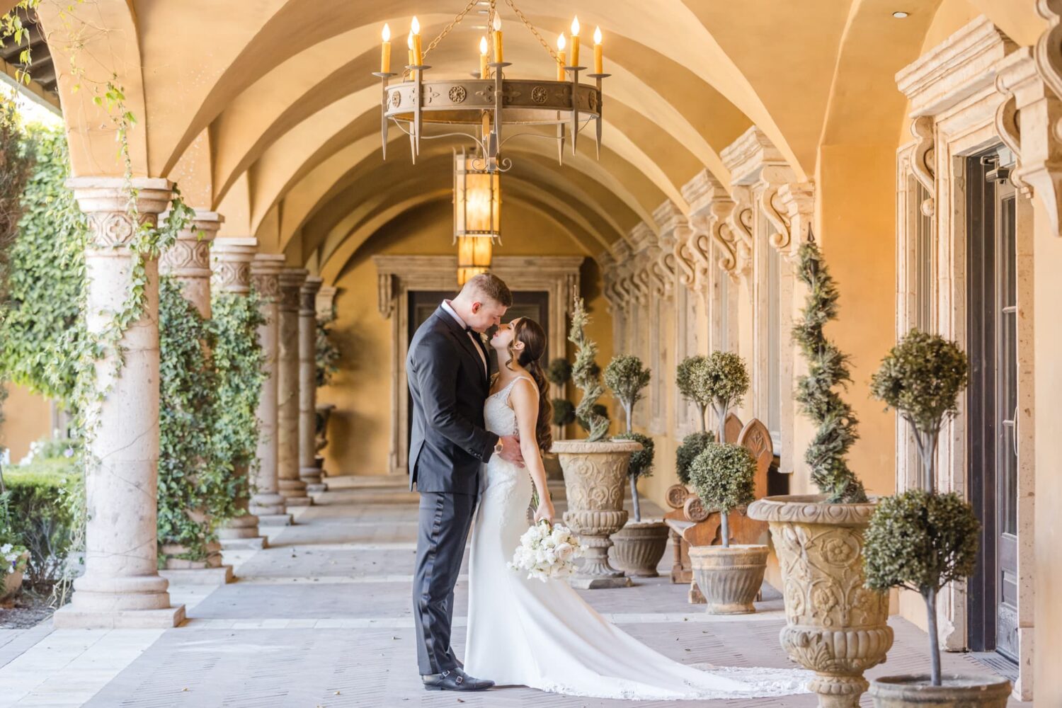 Black and Gold Wedding at Villa Siena Arizona Wedding Photographer b ride and groom kissing