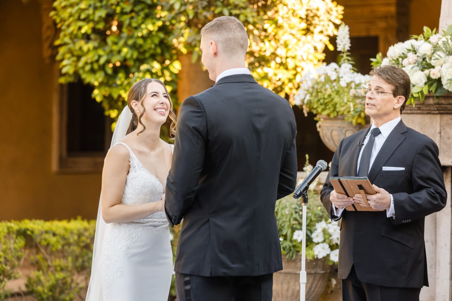 Black and Gold Wedding at Villa Siena Arizona Wedding Photographer bride smiling during ceremony